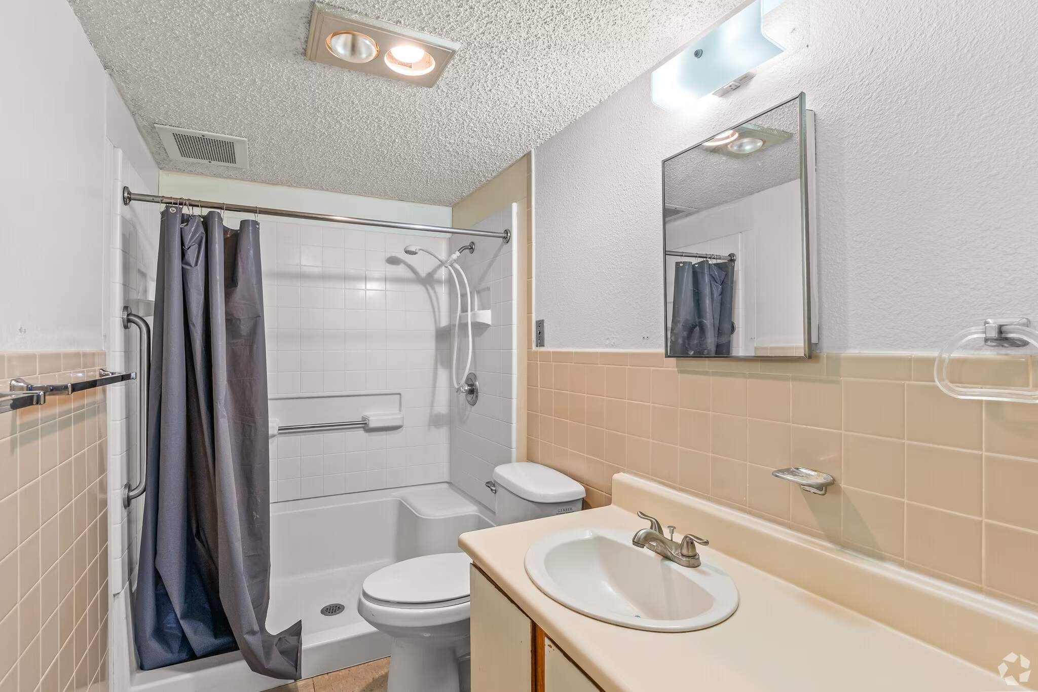 Bathroom with shower and vanity